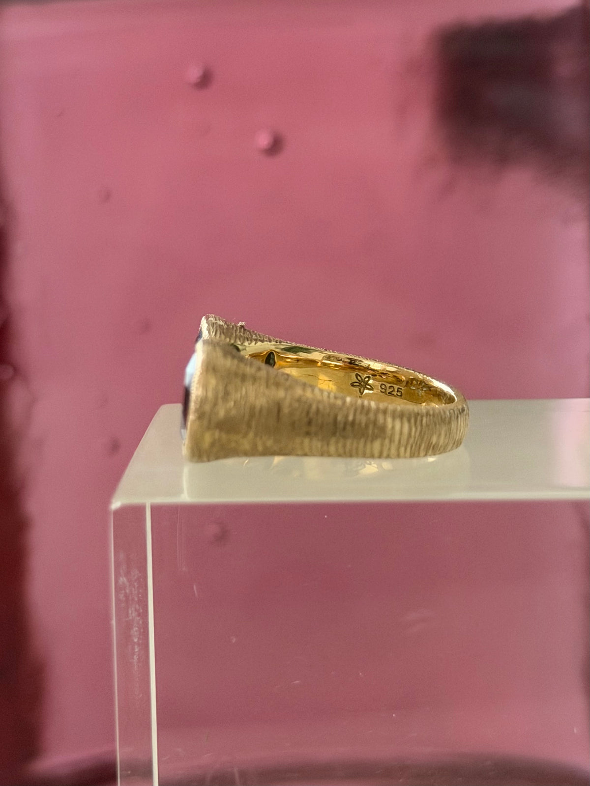 Detail showing the 925 Sterling Silver mark of a vermeil ring.