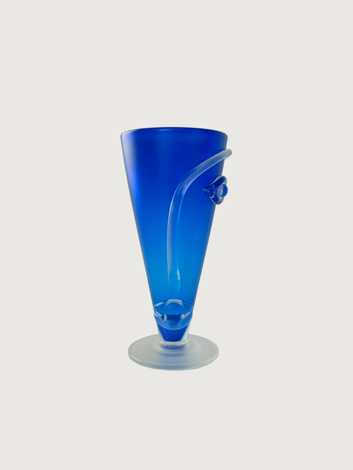 A handblown cobalt blue glass face vase with eyes, nose and mouth.Home Decor. Vintage. Collectible.