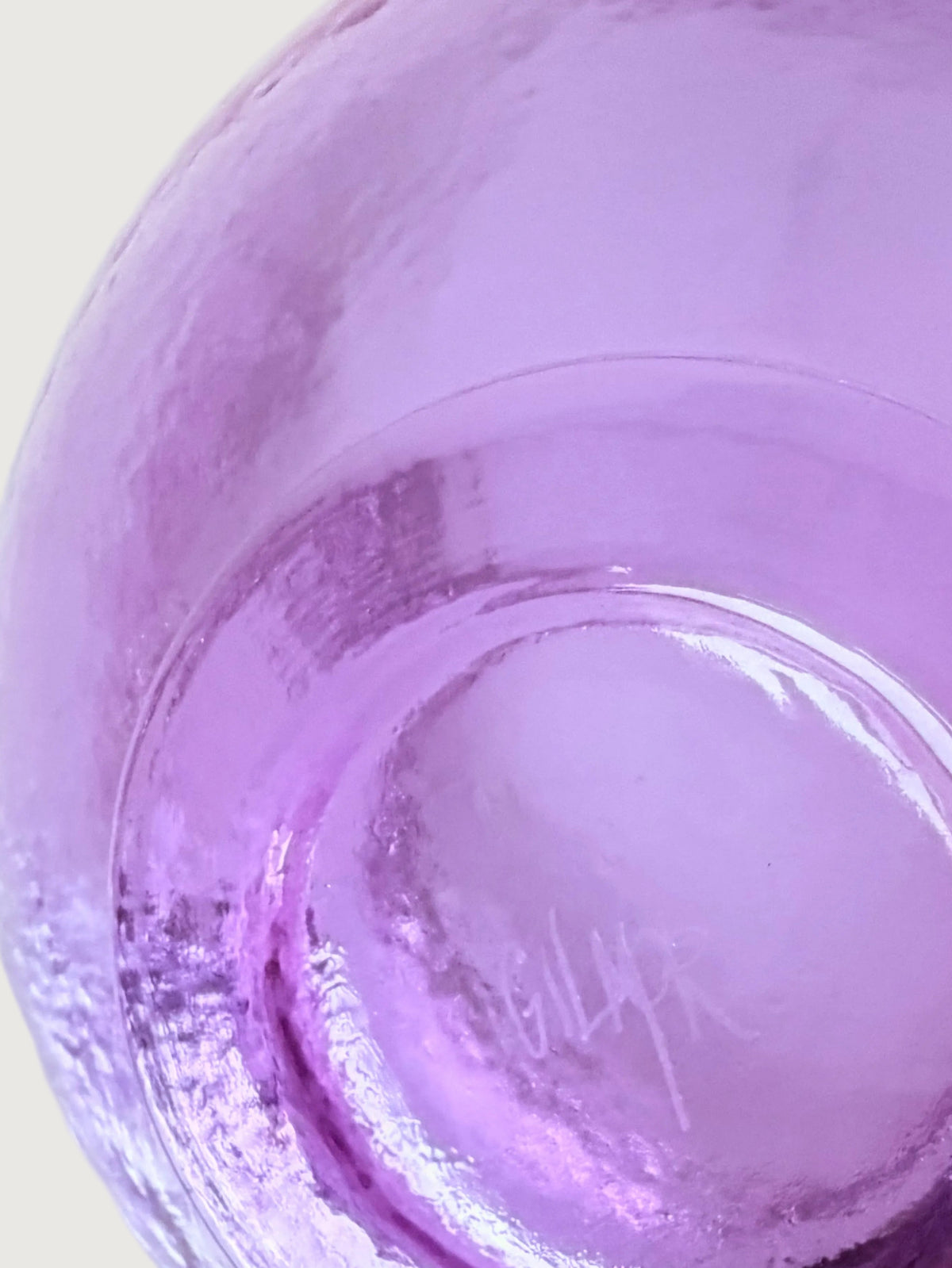 Detail showing John Gilmore's etched signature under a pink vase.