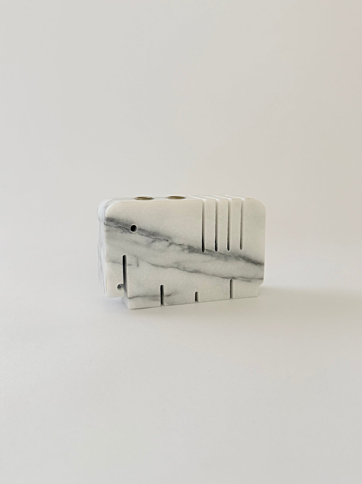 White and gray marble elephant penholder with slots for two pens and four slots
