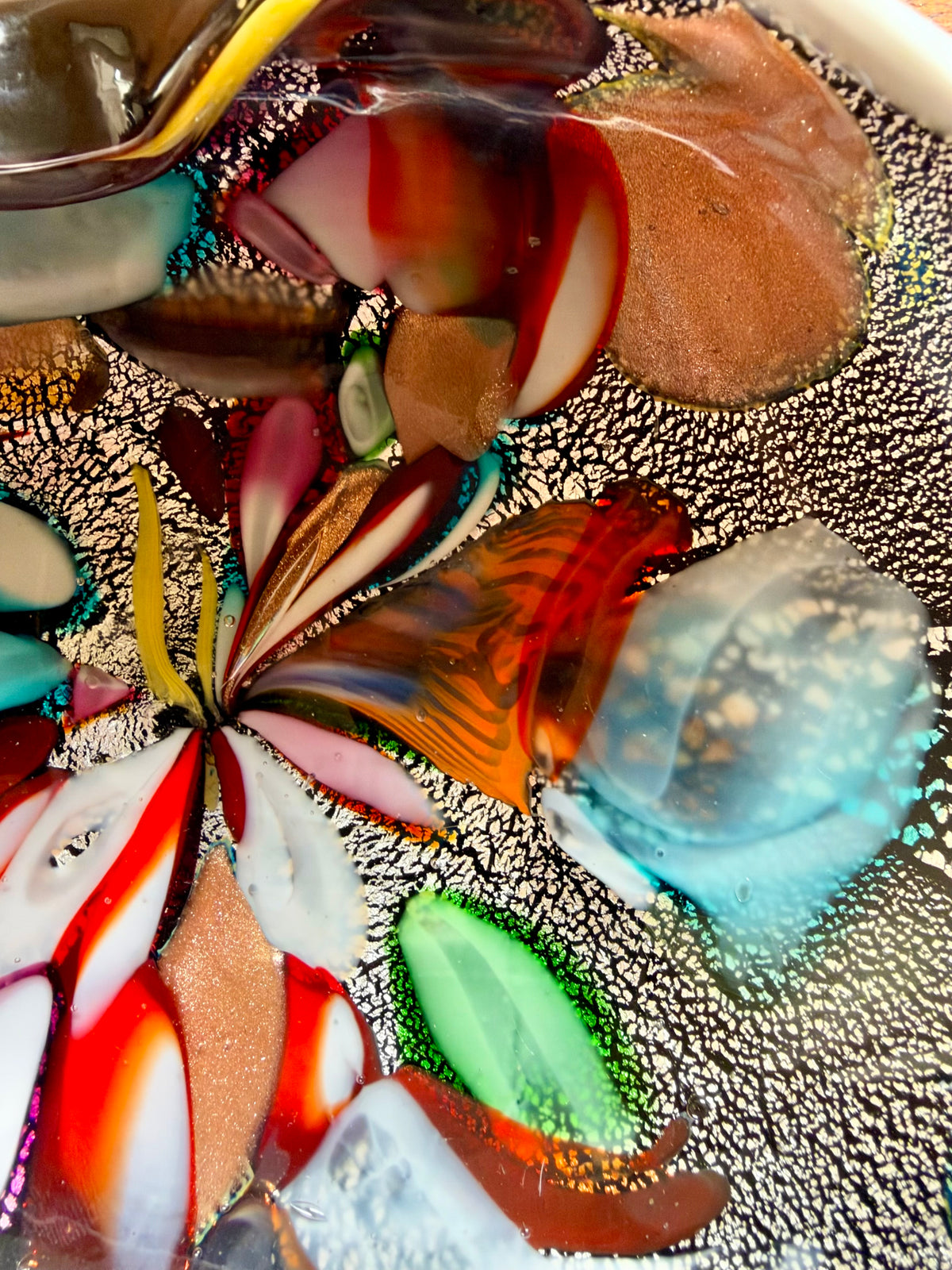 bold colored fragments, cane sections on silver leaf and aventurine, copper crystals that make the glass sparkle.