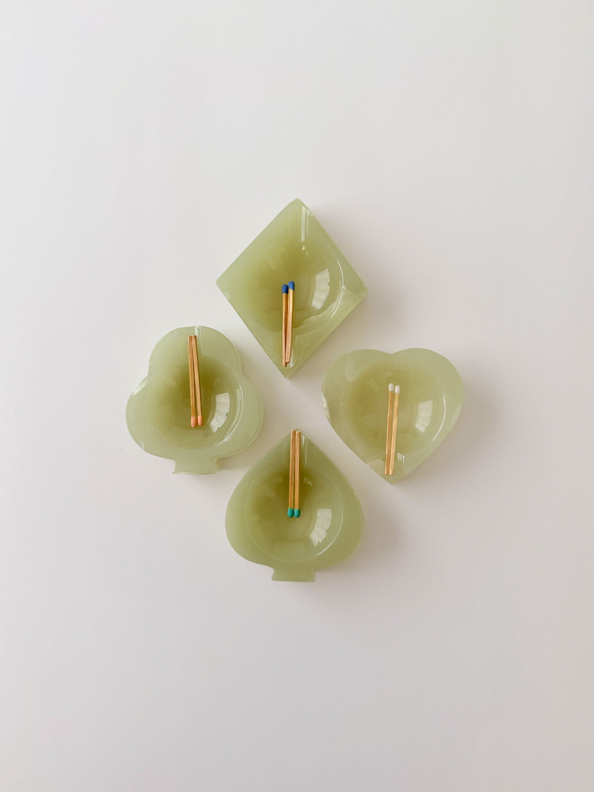 Set of four light green bridge set onyx ashtrays with matches 