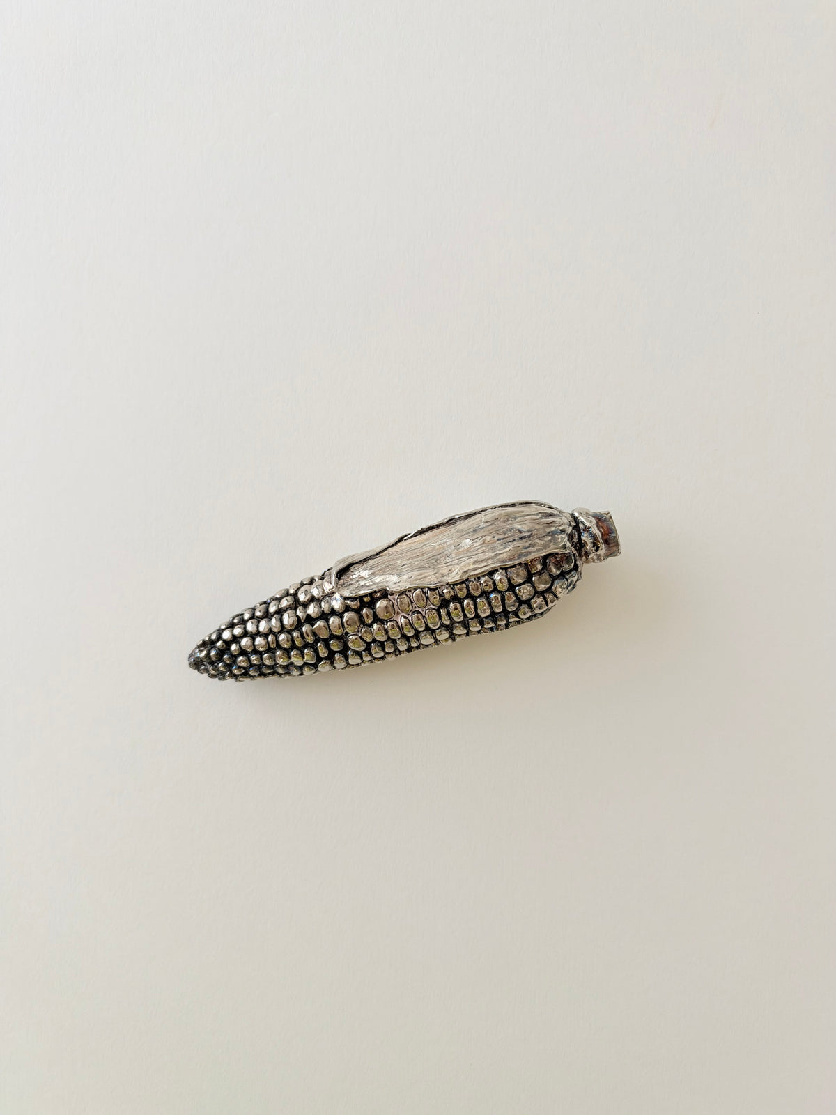 Silver -plate corn sculpture