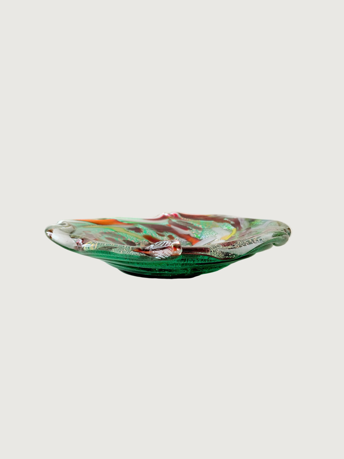 Profile view showing the green glass of Vintage Italian Leaf Shaped  Aventurine Dish